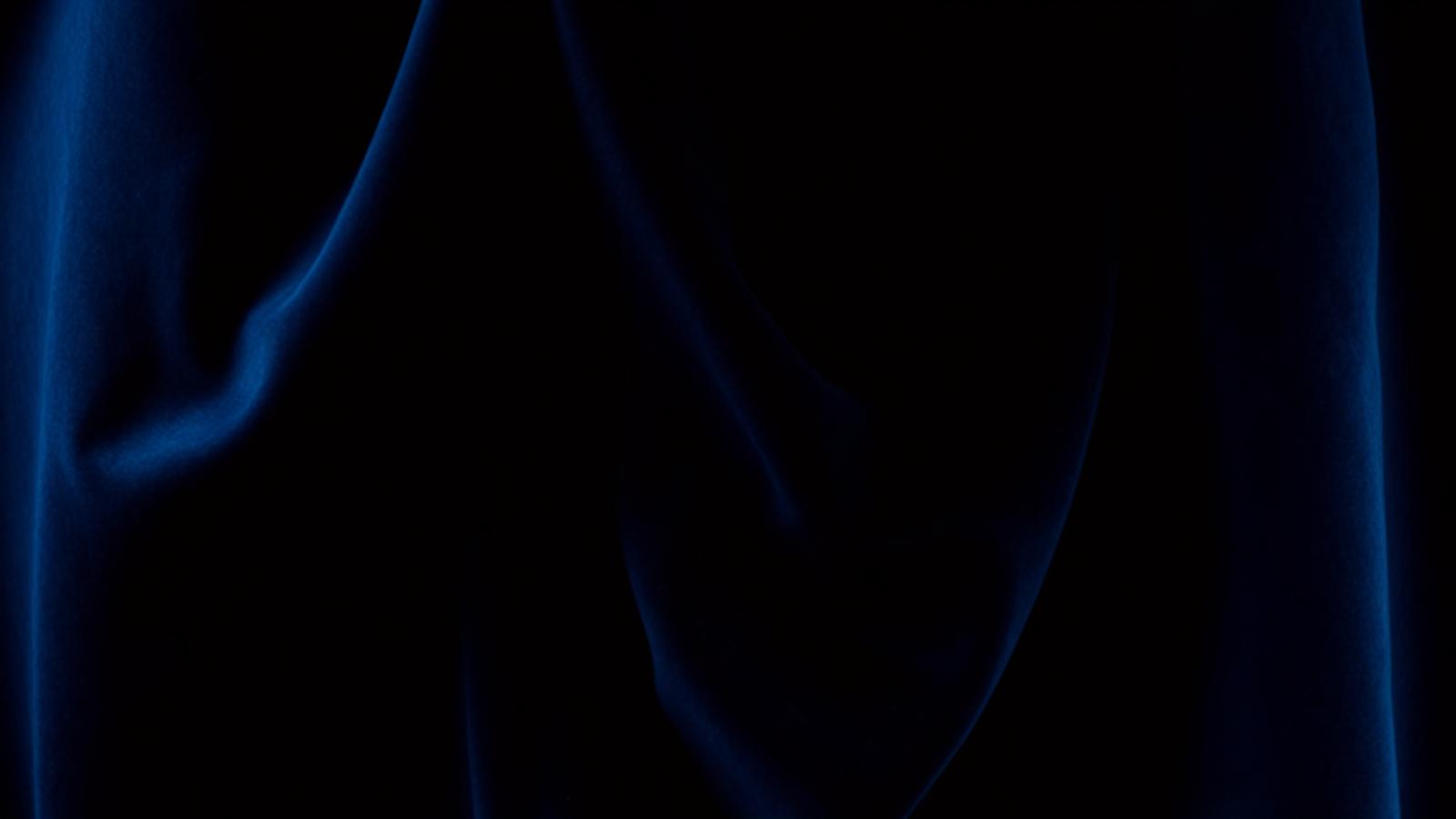 Deep blue velvet fabric with mysterious noir lighting